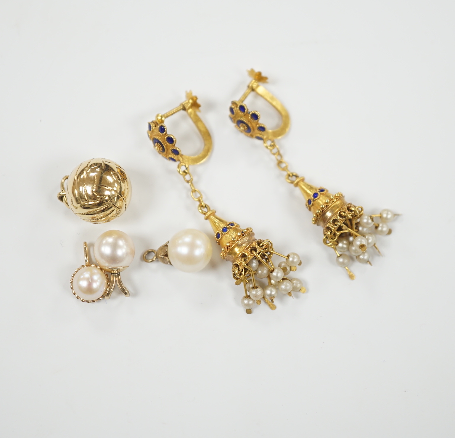 A pair of 585 tassel drop ear clips, 42mm, a yellow metal ball charm and three cultured pearl set pendants.